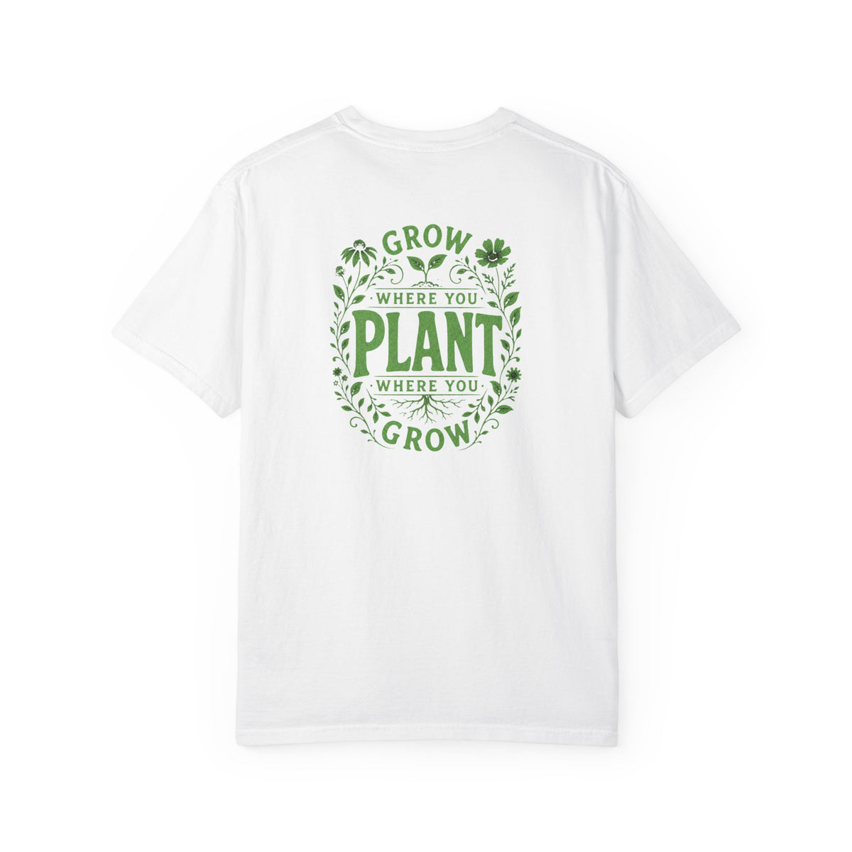 A white short-sleeve crewneck t-shirt featuring a green circular graphic on the back with the text 'GROW WHERE YOU PLANT WHERE YOU GROW' surrounded by leaf and clover illustrations.