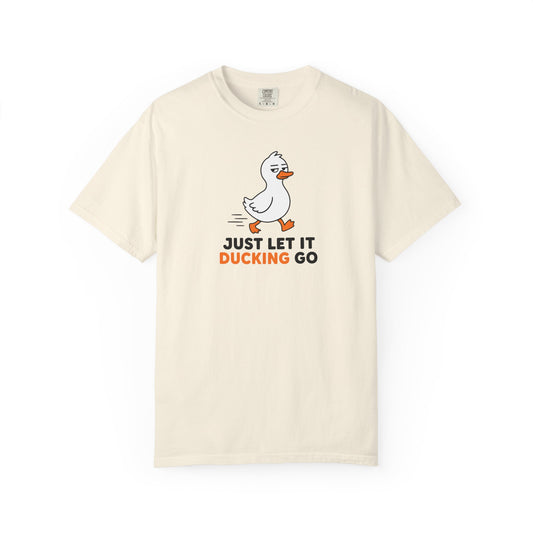 An ivory short-sleeve t-shirt with a cartoon duck graphic and the text 'JUST LET IT DUCKING GO' printed on the chest, displayed against a solid white background.