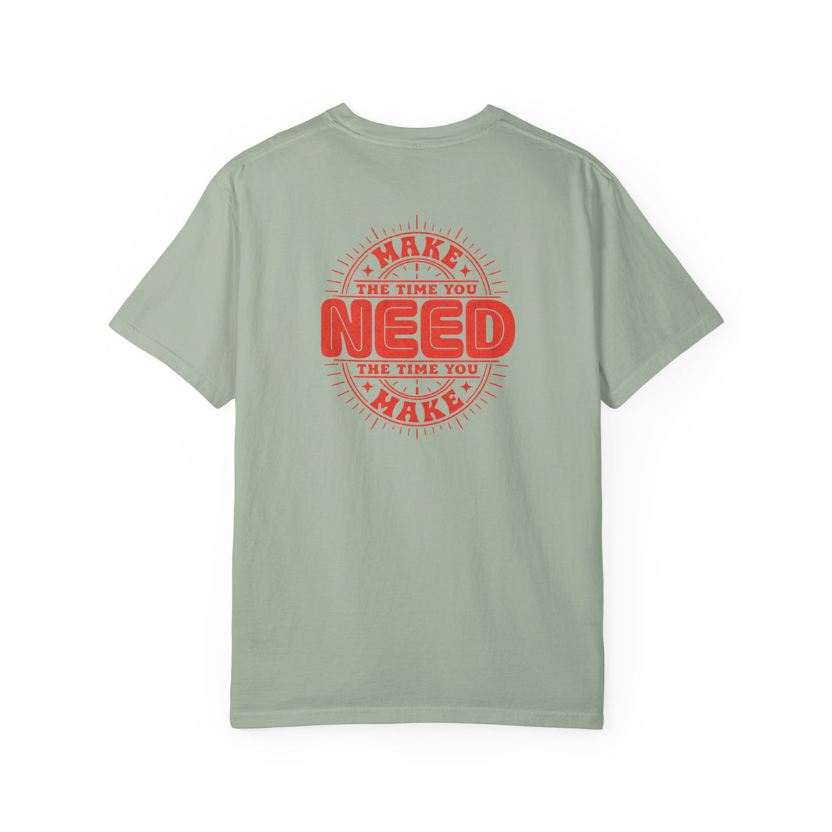 A sage green short-sleeve t-shirt with a red circular graphic on the back that reads 'MAKE THE TIME YOU NEED THE TIME YOU MAKE'.