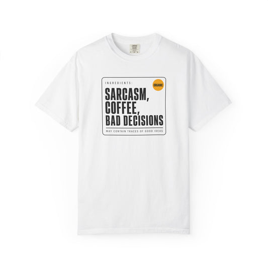 A white short-sleeve crewneck t-shirt with a black rectangular graphic on the chest. The graphic features the text 'SARCASM, COFFEE, BAD DECISIONS' in bold black letters, with 'Ingredients' and 'May Contain Traces of Good Ideas' in smaller text, and a small orange circle containing the word 'ORGANIC'.