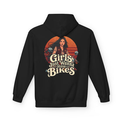 A black pullover hoodie shown from the back, featuring a large graphic print with the text 'Girls Just Wanna Have Bikes' and an illustration of a woman against an orange circular sunset.