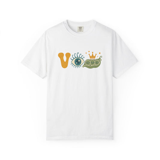 A white short-sleeve crewneck t-shirt featuring a graphic on the chest that spells 'VIP' using a yellow 'V', a blue-and-white EYE, and a green PEA pod with a small gold crown.