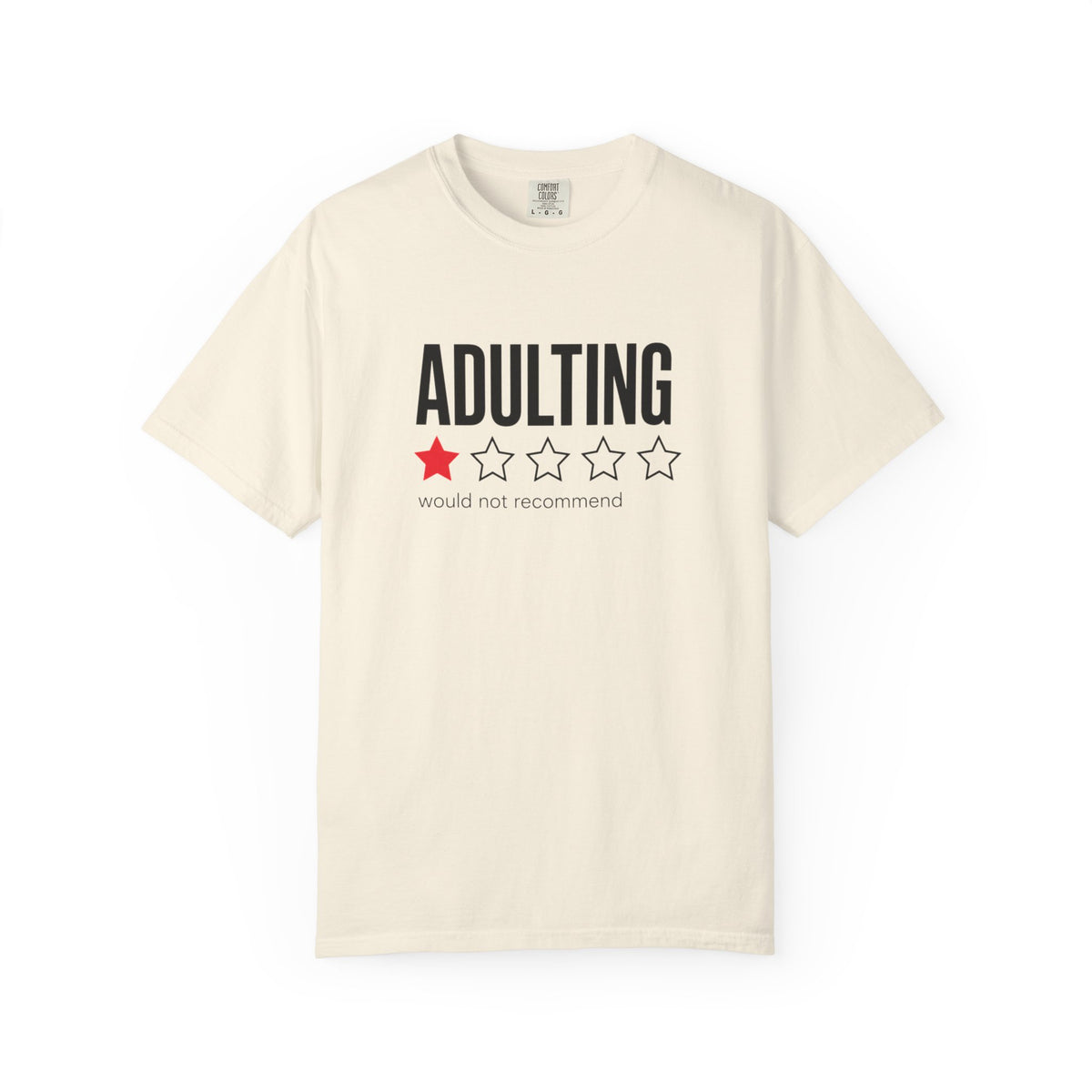 An off-white short-sleeve crewneck t-shirt with a graphic on the chest that reads 'ADULTING' in black bold letters above a one-star red and four-star white outline graphic, with the text 'would not recommend' underneath.