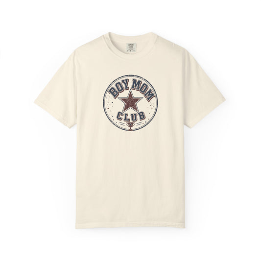 An ivory short-sleeve crewneck t-shirt featuring a circular vintage-style graphic on the chest that reads 'BOY MOM CLUB' around a central star.