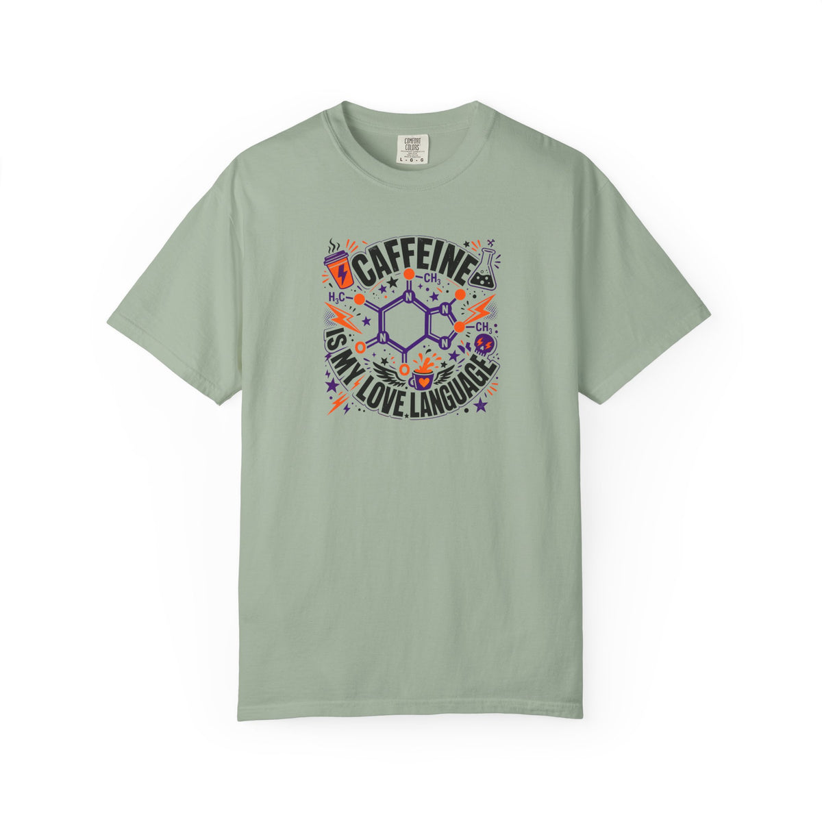 A sage green short-sleeve t-shirt with a colorful graphic on the chest that reads 'CAFFEINE IS MY LOVE LANGUAGE' around a chemical structure, displayed on a clean white background.