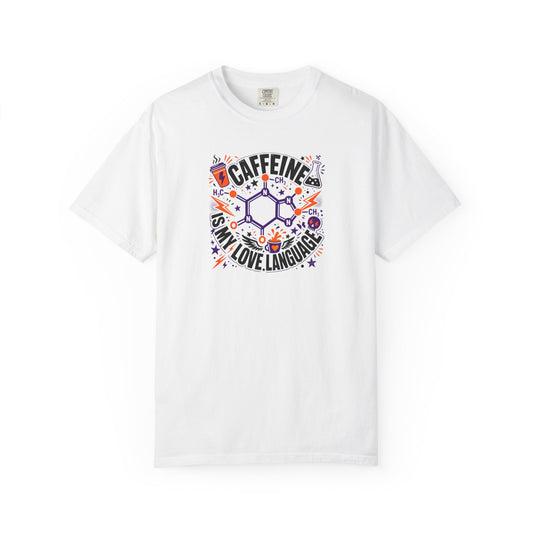 A white short-sleeve crewneck t-shirt featuring a colorful graphic print on the front. The graphic displays a chemical structure surrounded by the text 'CAFFEINE IS MY LOVE LANGUAGE' in black, accented with purple, orange, and blue doodles.