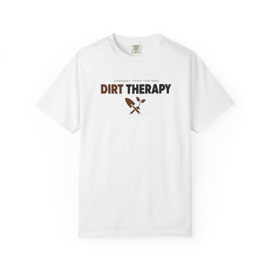 A white short-sleeve crewneck t-shirt with a graphic on the chest that reads 'DIRT THERAPY' in brown and black, with a small crossed shovel and plant icon below it, displayed on a clean white background.