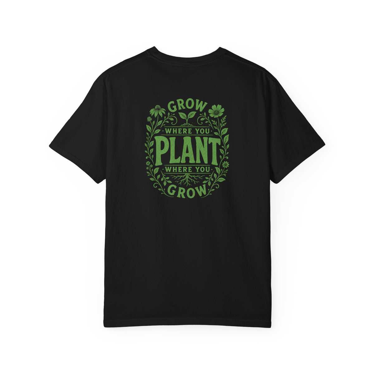 A black short-sleeve t-shirt with a green graphic on the back reading 'GROW WHERE YOU PLANT WHERE YOU GROW' surrounded by leaves and clovers, shown against a plain white background.
