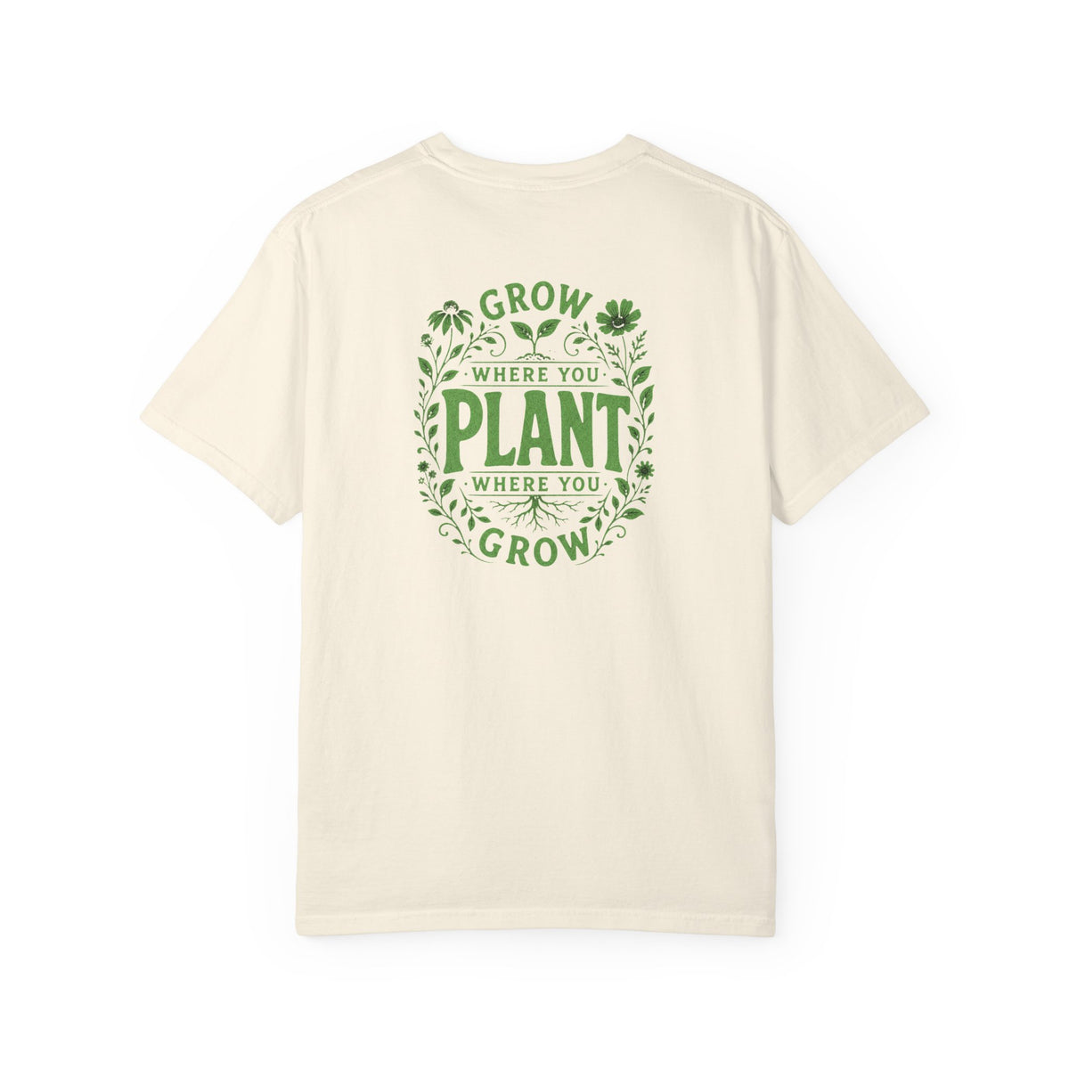 An ivory short-sleeve t-shirt with a green graphic on the back reading 'GROW WHERE YOU PLANT WHERE YOU GROW' surrounded by leaves and clovers, shown against a plain white background.