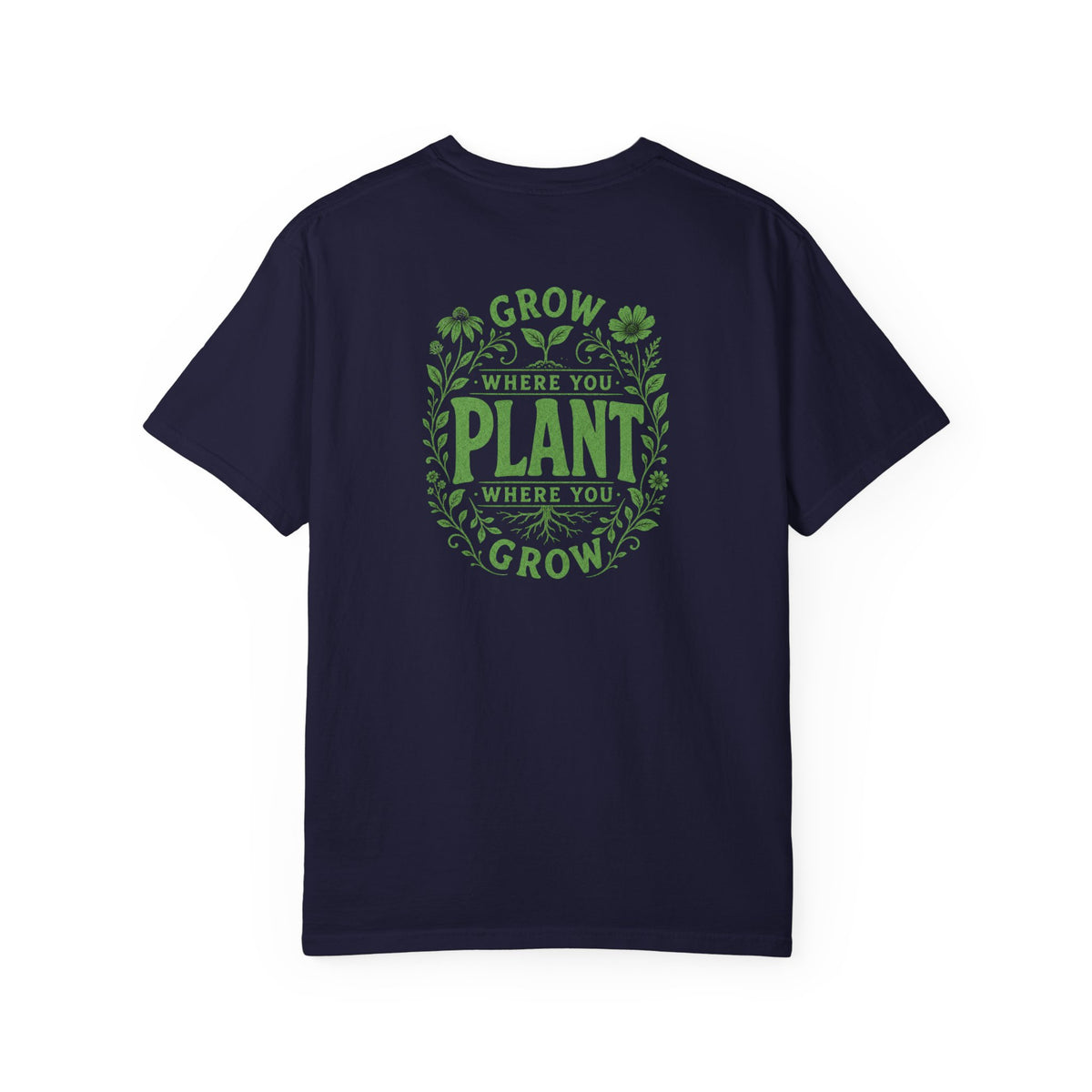 A navy blue short-sleeve crewneck t-shirt featuring a green circular graphic on the back with the text 'GROW WHERE YOU PLANT WHERE YOU GROW' surrounded by leaf and clover illustrations.