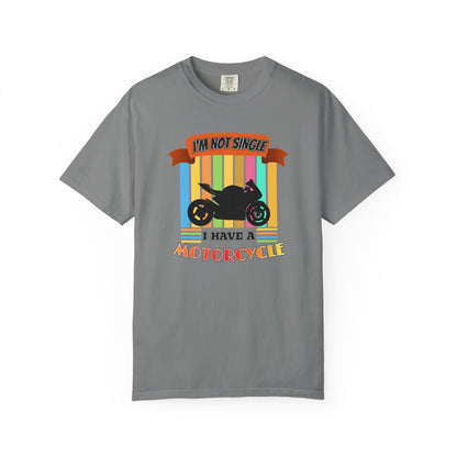 A gray short-sleeve crewneck t-shirt featuring a colorful graphic print of a black motorcycle with the text 'I'M NOT SINGLE I HAVE A MOTORCYCLE' on a white background.