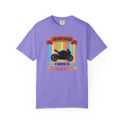 A purple short-sleeve crewneck t-shirt featuring a motorcycle graphic with the text 'I'M NOT SINGLE I HAVE A MOTORCYCLE' on a white background.