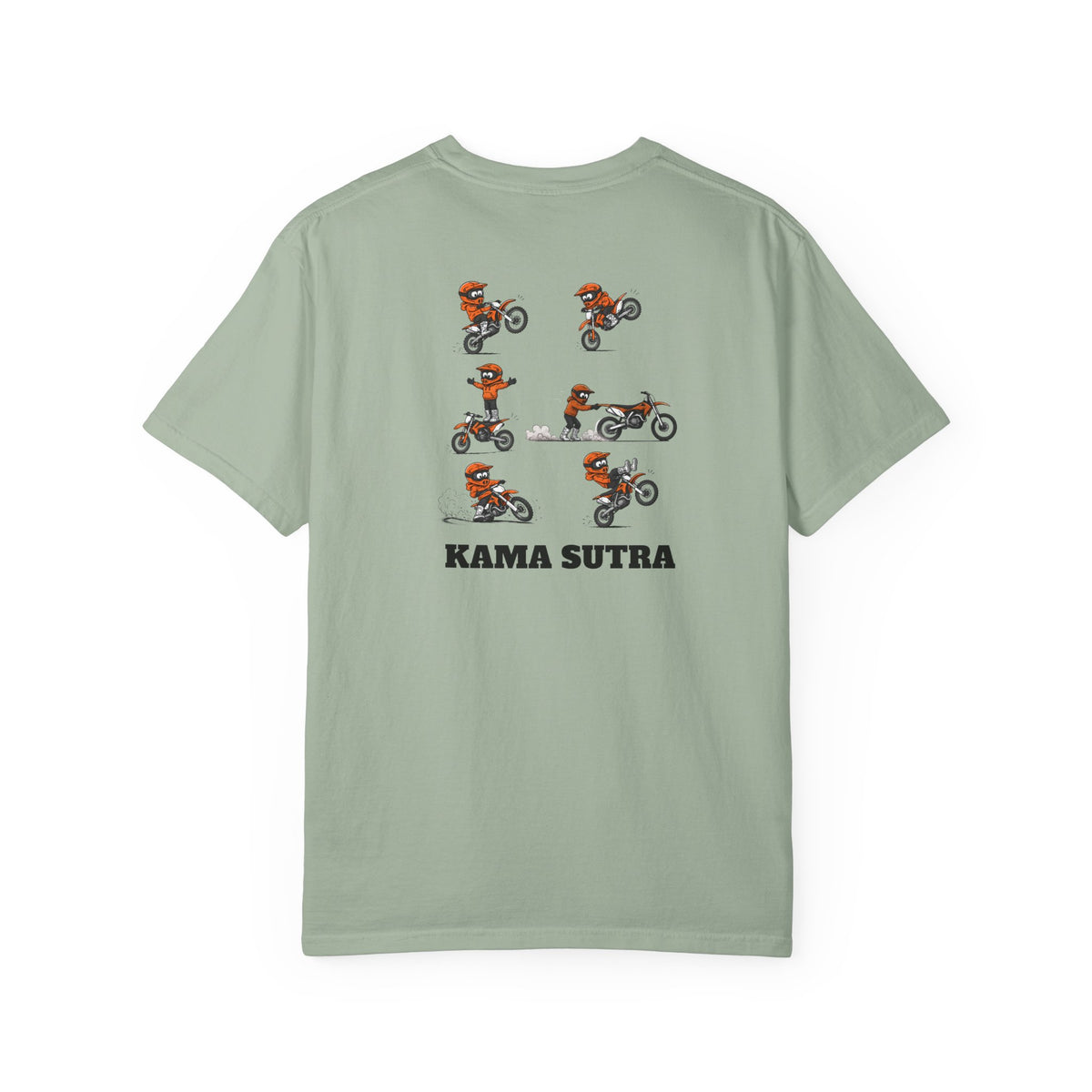 A sage green short-sleeve t-shirt with a graphic print of a motocross rider in an orange and white KTM suit performing a jump, with the text 'KAMA SUTRA' printed below in black.