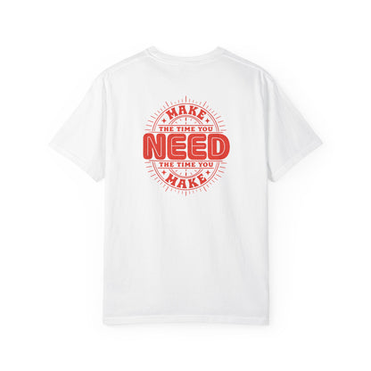 A white short-sleeve crewneck t-shirt with a red circular graphic on the back that reads 'MAKE THE TIME YOU NEED THE TIME YOU MAKE'.