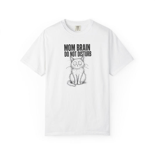 A white short-sleeve crewneck t-shirt featuring a black graphic of a cat with large eyes and the text 'MOM BRAIN DO NOT DISTURB' printed on the chest.