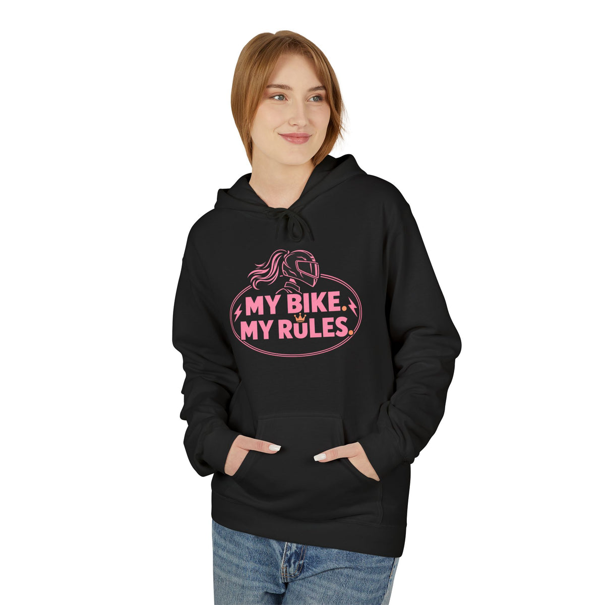 A woman wearing a black pullover hoodie with the words 'MY BIKE MY RULES' printed in pink text on the front, paired with blue jeans, set against a plain white background.