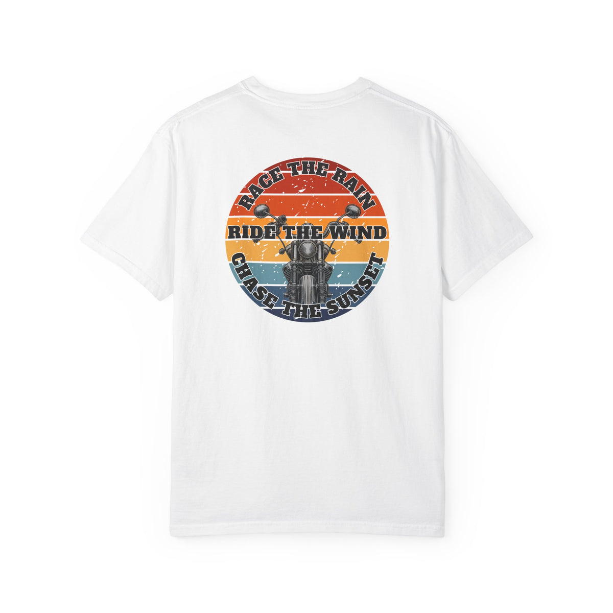 A white short-sleeve crewneck t-shirt with a retro circular graphic on the chest. The graphic features a motorcycle silhouette and the text 'RACE THE RAIN', 'RIDE THE WIND', and 'CHASE THE SUNSET' in a distressed sunset color palette of orange, yellow, and blue.