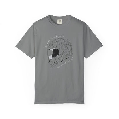 A gray short-sleeve crewneck t-shirt featuring a black line art graphic of a geometric motorcycle helmet in the center, with the text 'When the helmet goes on, the world goes off' curved around it.